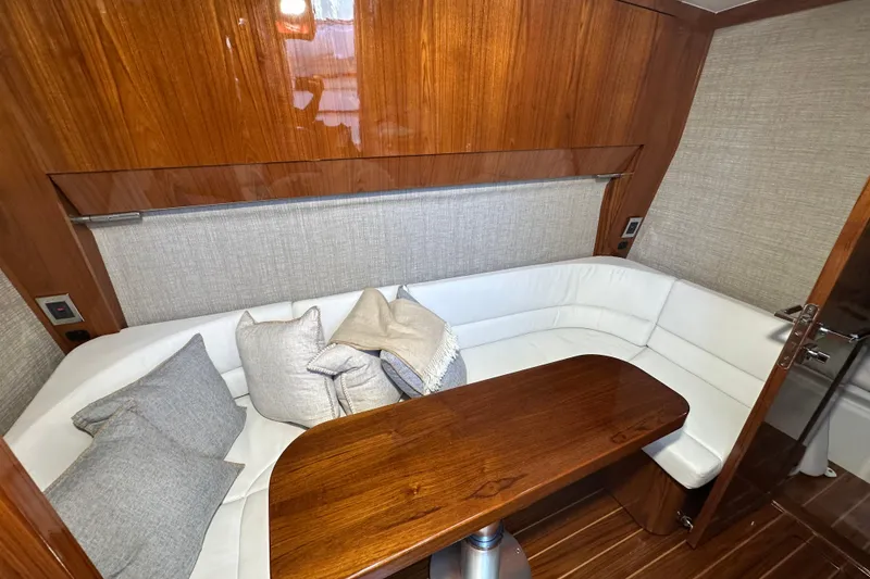 Slide: The Image of Luxurious interior of 2021 HCB 65 Estrella yacht with elegant wood and plush seating. - 33