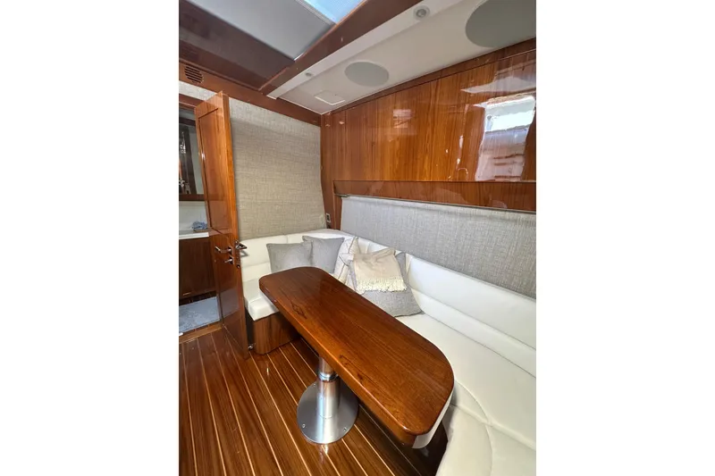 Slide: The Image of Luxurious interior of 2021 HCB 65 Estrella yacht with elegant wood finishes and plush seating. - 35