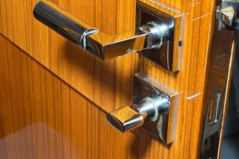 Slide: The Image of Chrome door handle on polished wood, HCB 65 Estrella 2021 yacht interior. - 36