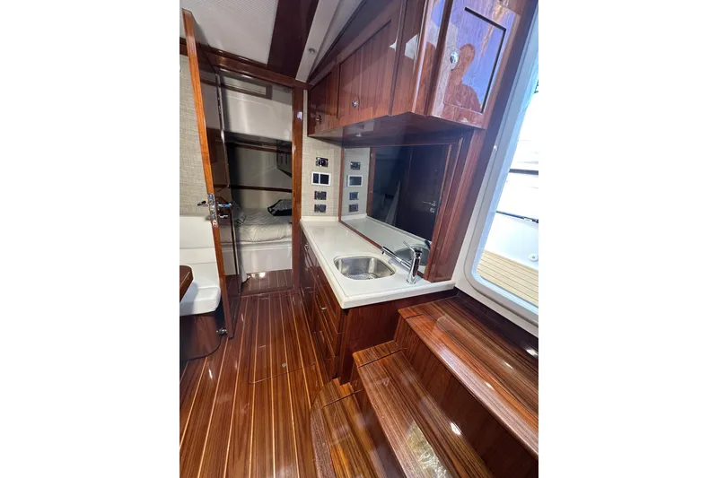 Slide: The Image of Luxurious interior of 2021 HCB 65 Estrella yacht with polished wood and modern amenities. - 40
