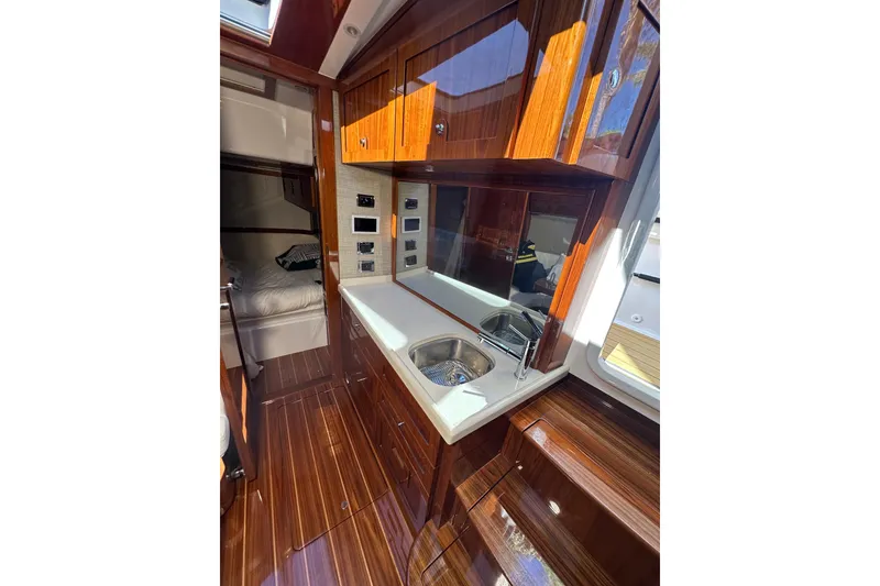 Slide: The Image of Luxurious interior of 2021 HCB 65 Estrella yacht with polished wood and modern amenities. - 41