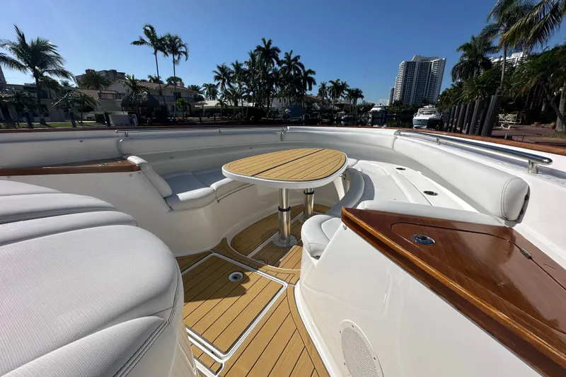 Slide: The Image of Luxurious 2021 HCB 65 Estrella yacht deck with seating and table, surrounded by palm trees. - 45
