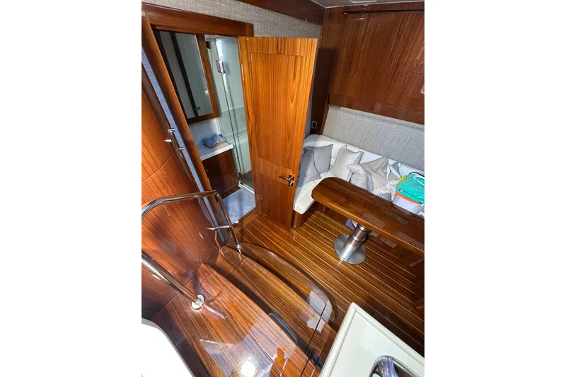 Slide: The Image of Luxurious interior of 2021 HCB 65 Estrella yacht with wooden finishes and cozy seating area. - 48