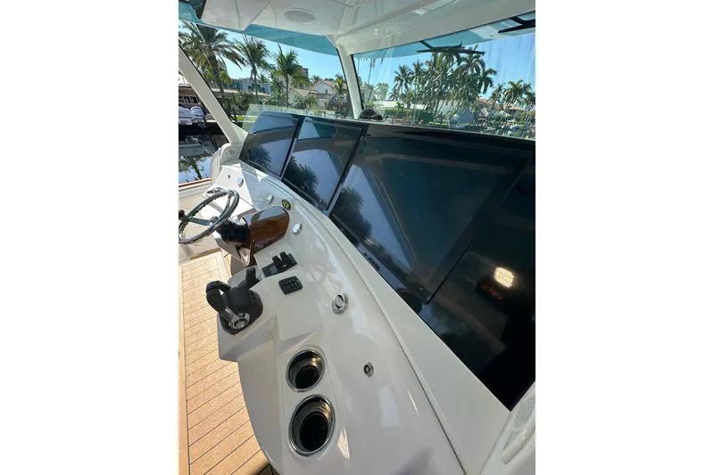 Slide: The Image of Helm of 2021 HCB 65 Estrella yacht with modern navigation screens and controls. - 49