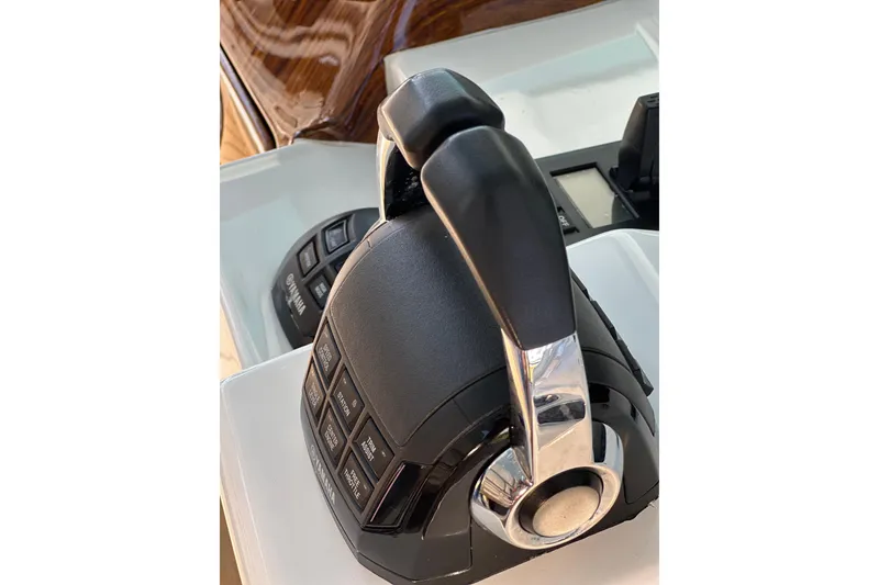 Slide: The Image of Throttle controls on a 2021 HCB 65 Estrella boat, featuring Yamaha branding. - 50