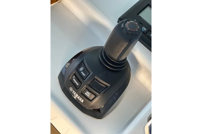 Slide: The Image of Yamaha joystick control on 2021 HCB 65 Estrella boat dashboard. - 51