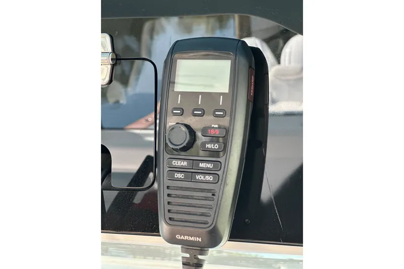 Slide: The Image of Garmin marine radio on 2021 HCB 65 Estrella boat dashboard. - 55