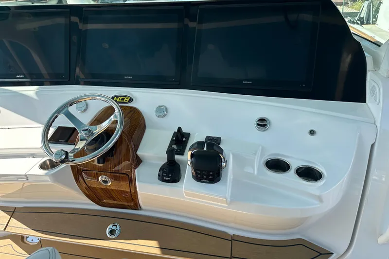 Slide: The Image of Helm of 2021 HCB 65 Estrella with steering wheel and navigation screens. - 58