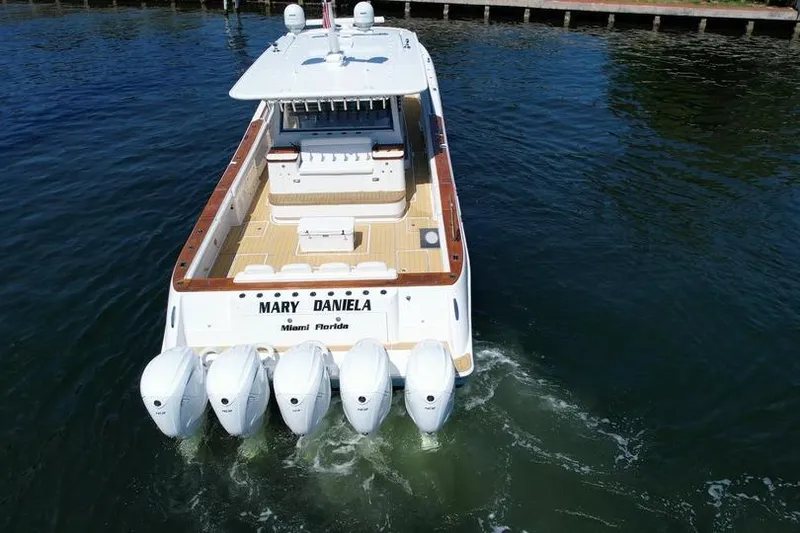 Slide: The Image of 2021 HCB 65 Estrella boat with five engines, cruising in Miami waters. - 6
