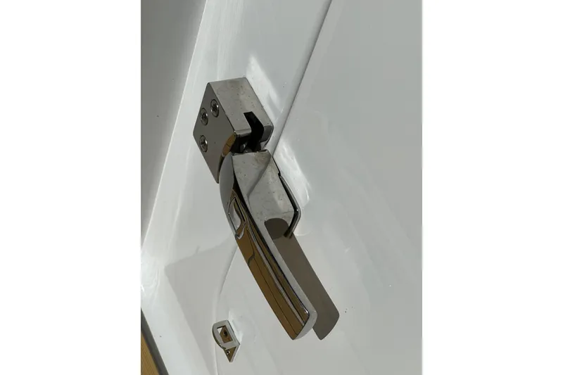 Slide: The Image of Chrome door handle on a 2021 HCB 65 Estrella boat. - 67