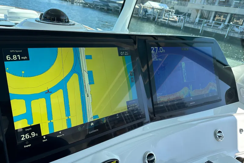 Slide: The Image of Dashboard of a 2021 HCB 65 Estrella with navigation and sonar displays. - 70