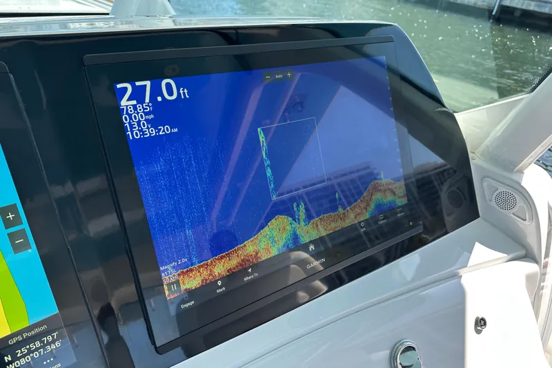 Slide: The Image of Dashboard of 2021 HCB 65 Estrella displaying sonar and navigation data. - 71