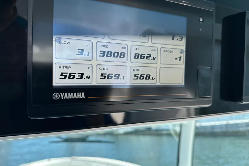 Slide: The Image of Yamaha display on 2021 HCB 65 Estrella showing fuel and trip data. - 74