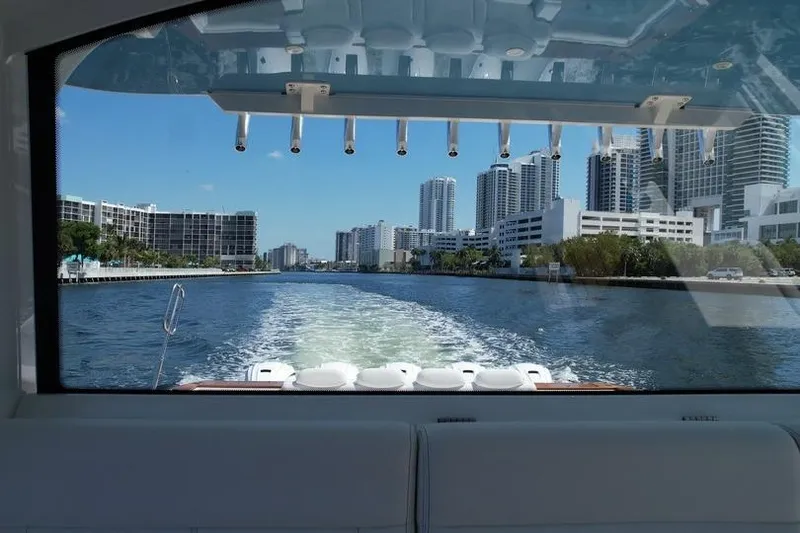 Slide: The Image of View from 2021 HCB 65 Estrella boat, city skyline in background, clear blue sky. - 77