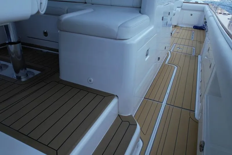 Slide: The Image of Interior view of 2021 HCB 65 Estrella boat with sleek seating and teak flooring. - 81