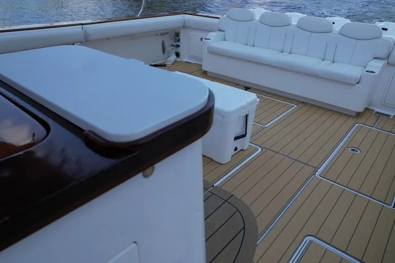 Slide: The Image of Luxurious deck of 2021 HCB 65 Estrella yacht with white seating and wooden flooring. - 83