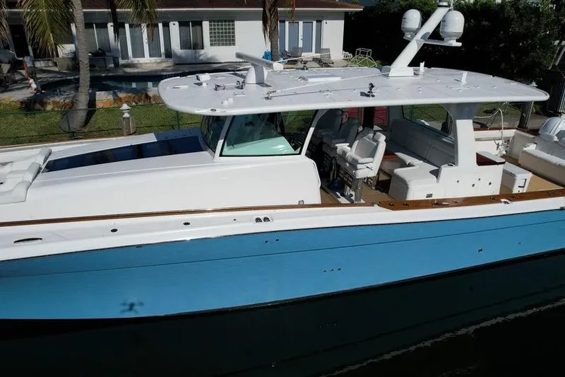 Slide: The Image of 2021 HCB 65 Estrella yacht docked, featuring sleek design and spacious deck. - 88