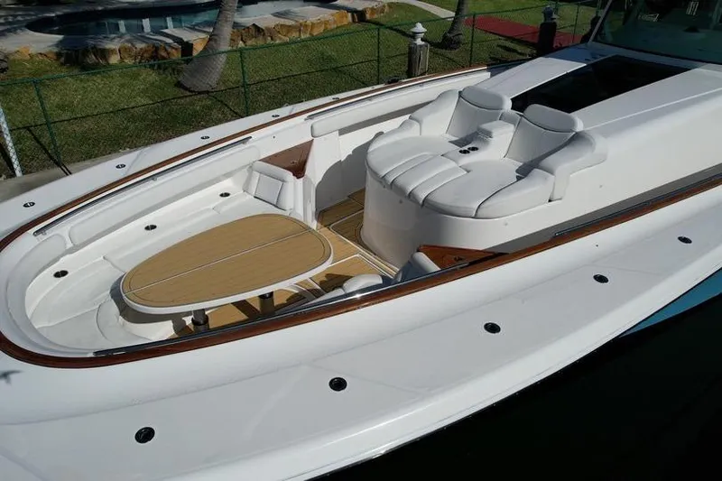 Slide: The Image of Luxurious 2021 HCB 65 Estrella boat with elegant seating and wooden table. - 89