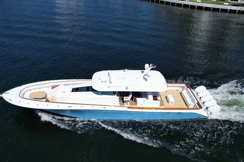 Slide: The Image of 2021 HCB 65 Estrella luxury yacht cruising on calm waters, showcasing sleek design and powerful engines. - 93