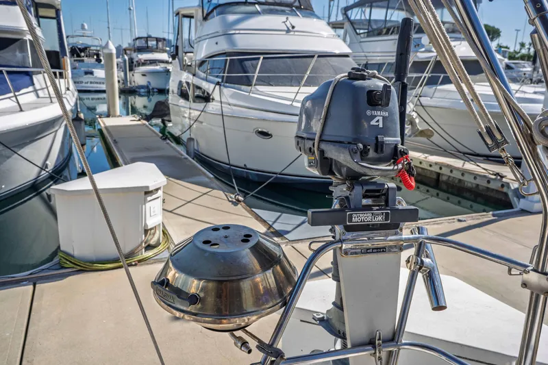 Slide: The Image of Jeanneau Sun Odyssey 45.2 sailboat with Yamaha outboard motor at marina, 2003 model. - 28