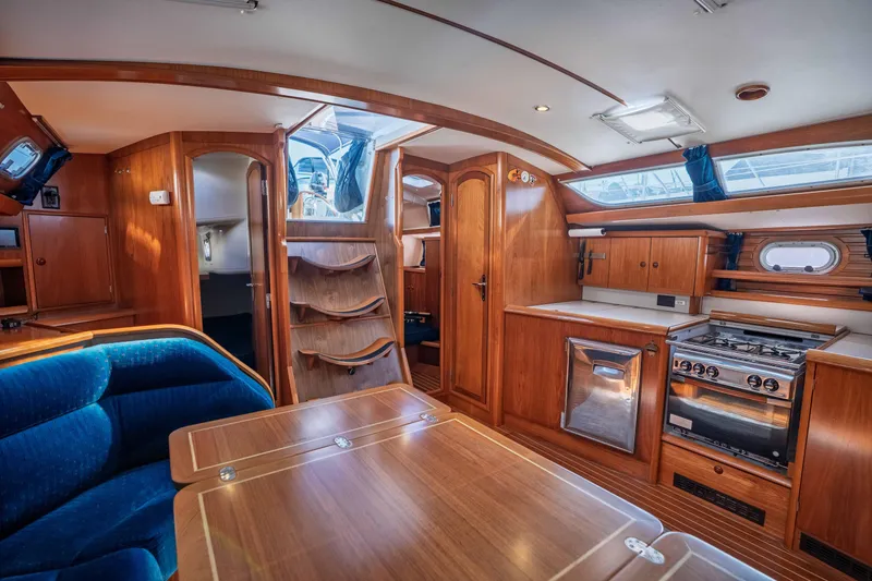 Slide: The Image of Interior of 2003 Jeanneau Sun Odyssey 45.2 yacht with wood finish and modern amenities. - 43