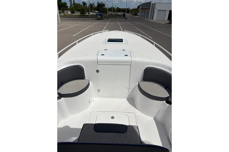 Slide: The Image of 2025 Glasstream 328 SCX boat interior with seating and storage compartments. - 11