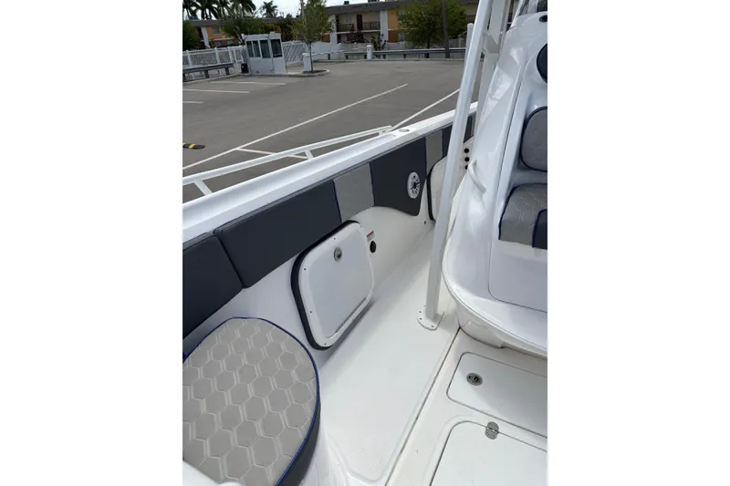 Slide: The Image of 2025 Glasstream 328 SCX boat interior with seating and storage compartments. - 18