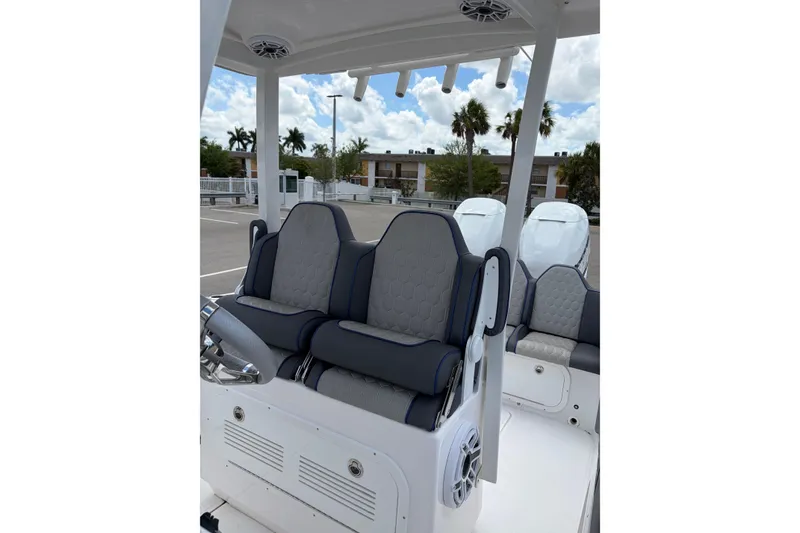 Slide: The Image of 2025 Glasstream 328 SCX boat interior with plush seating and modern design. - 26