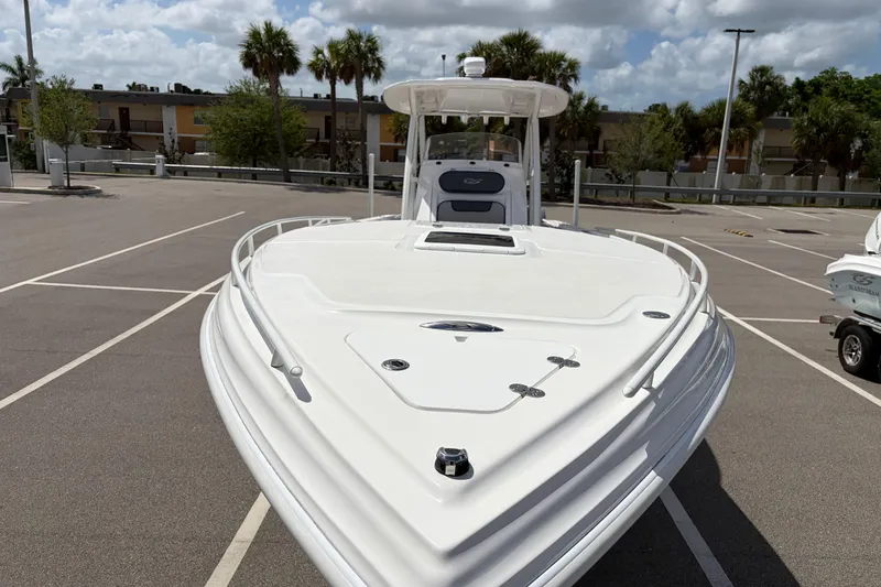Slide: The Image of 2025 Glasstream 328 SCX boat in parking lot, showcasing sleek design and spacious deck. - 35