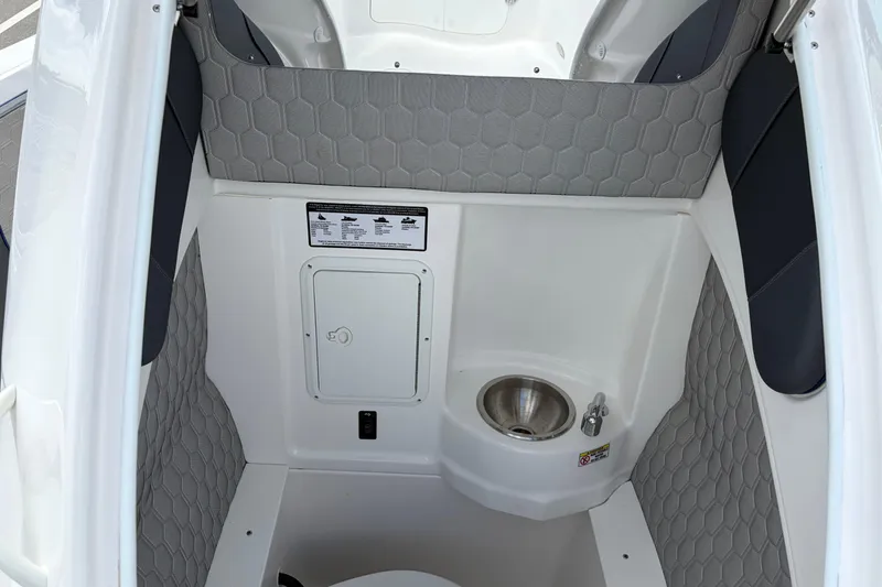 Slide: The Image of Interior of 2025 Glasstream 328 SCX boat with sink and storage compartment. - 42
