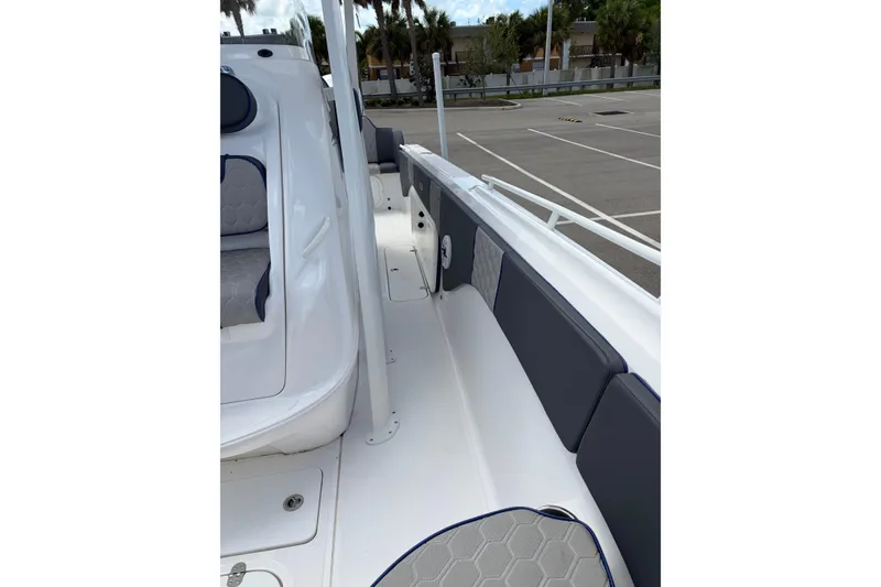 Slide: The Image of 2025 Glasstream 328 SCX boat interior with sleek seating and modern design. - 7