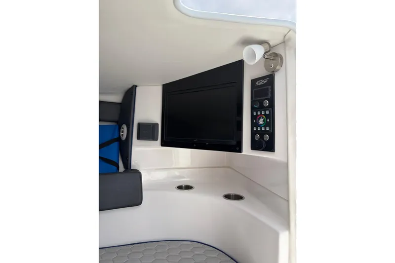 Slide: The Image of Interior of 2025 Glasstream 328 SCX boat featuring control panel and seating area. - 9