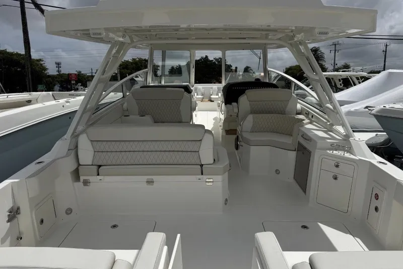 Slide: The Image of 2026 World Cat 400 DC-X Island boat interior with luxurious seating and modern design. - 12