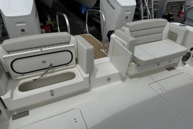 Slide: The Image of Luxury seating and storage on 2026 World Cat 400 DC-X Island boat deck. - 26