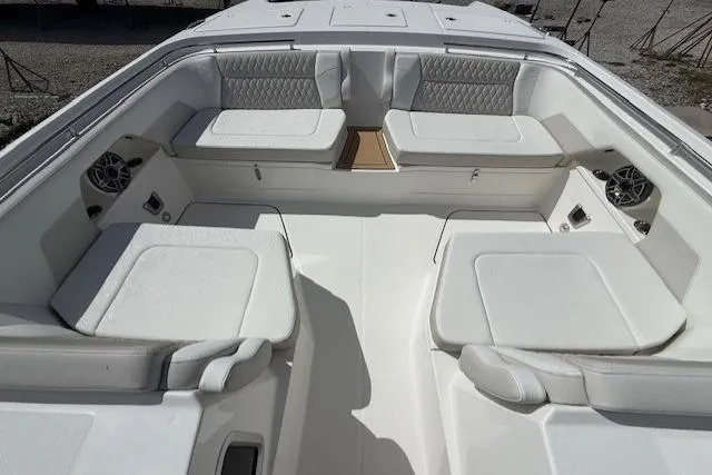 Slide: The Image of Luxurious seating area on 2026 World Cat 400 DC-X Island boat, featuring plush white upholstery. - 6