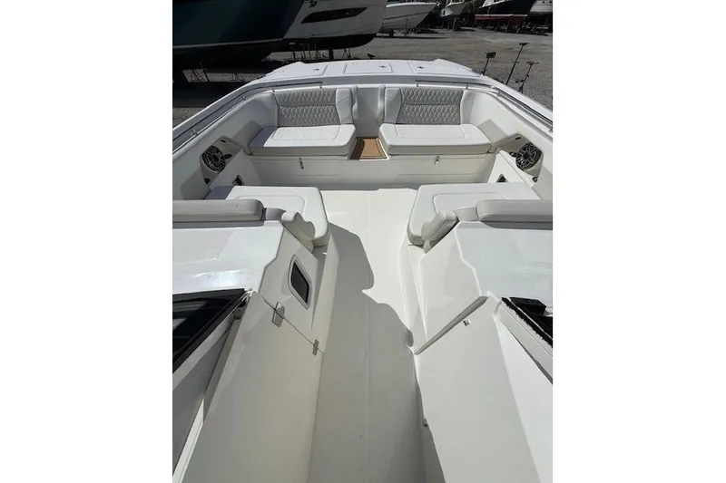Slide: The Image of 2026 World Cat 400 DC-X Island boat interior with spacious seating and modern design. - 7