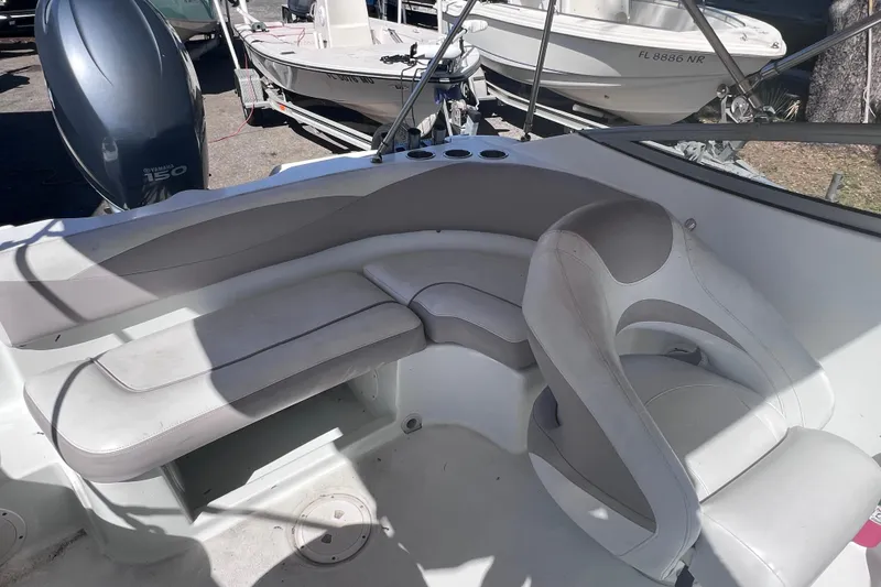 Slide: The Image of Interior view of a 2012 SouthWind 212 SD boat with seating and Yamaha 150 engine. - 11