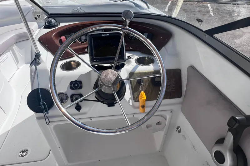 Slide: The Image of Steering wheel and dashboard of a 2012 SouthWind 212 SD boat. - 14
