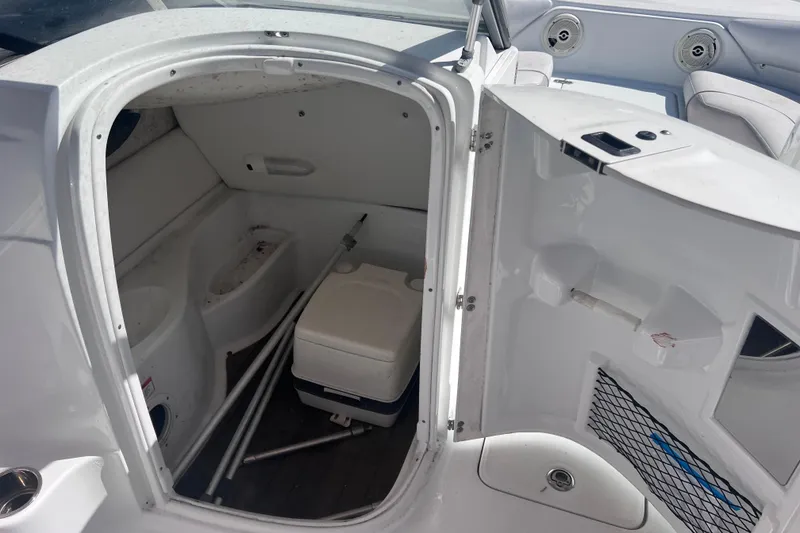 Slide: The Image of Interior storage compartment of a 2012 SouthWind 212 SD boat with cooler and accessories. - 19