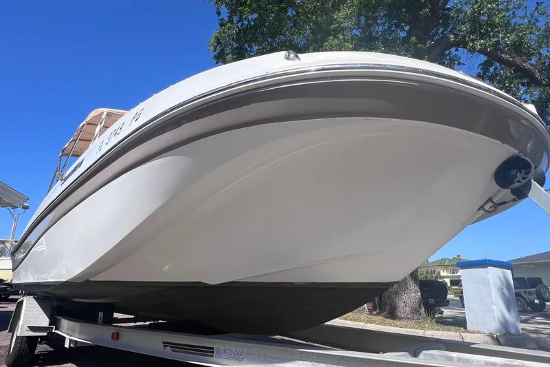 Slide: The Image of 2012 SouthWind 212 SD boat on trailer under clear blue sky. - 2