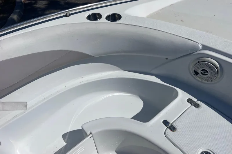 Slide: The Image of Interior view of a 2012 SouthWind 212 SD boat, featuring seating and speaker. - 21