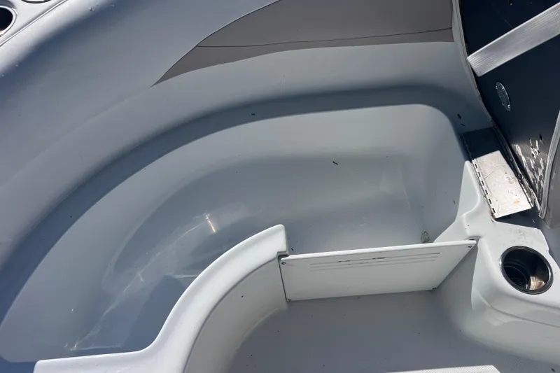 Slide: The Image of Interior view of a 2012 SouthWind 212 SD boat, showcasing seating and cup holder. - 22