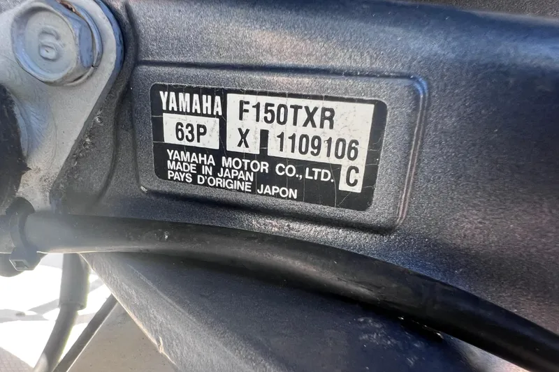 Slide: The Image of Close-up of Yamaha F150TXR engine label on a 2012 SouthWind 212 SD boat. - 26