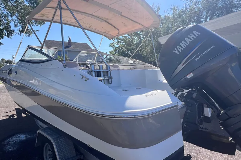 Slide: The Image of 2012 SouthWind 212 SD boat with Yamaha four-stroke engine, parked on a trailer. - 5
