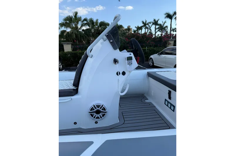 Slide: The Image of 2026 Highfield Sport 420 boat interior with steering console and modern controls. - 6