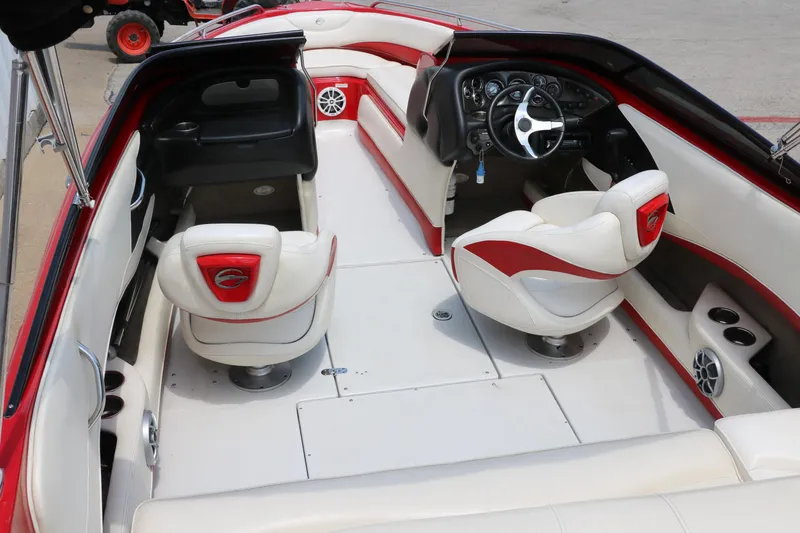 Slide: The Image of Interior of a 2009 Crownline 23 SS boat with white and red seating. - 15