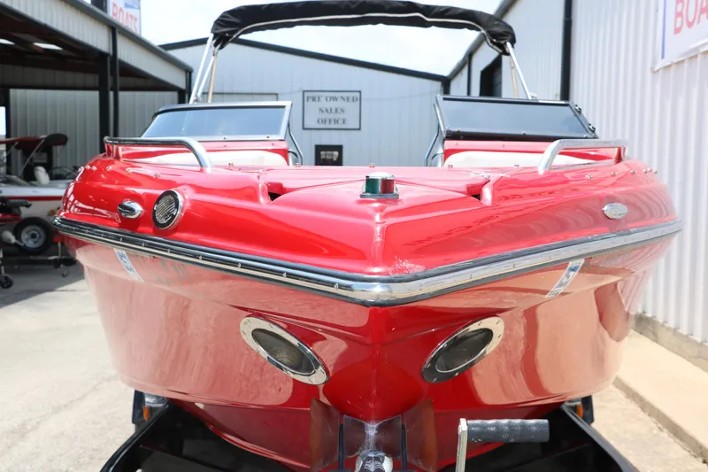 Slide: The Image of Red 2009 Crownline 23 SS boat displayed at a sales office. - 18