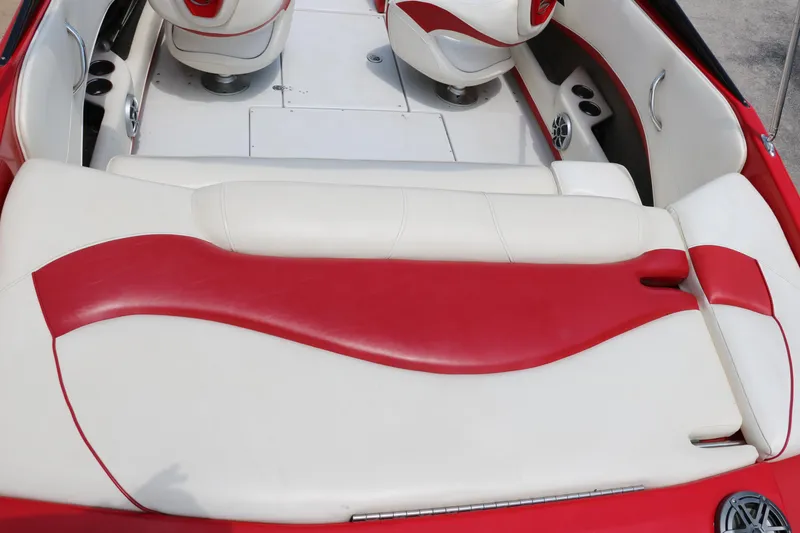 Slide: The Image of 2009 Crownline 23 SS boat interior with red and white seating and modern design. - 22
