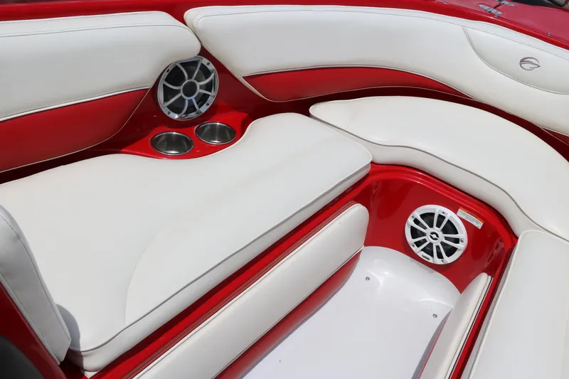 Slide: The Image of 2009 Crownline 23 SS boat interior with red and white seating and built-in speakers. - 36