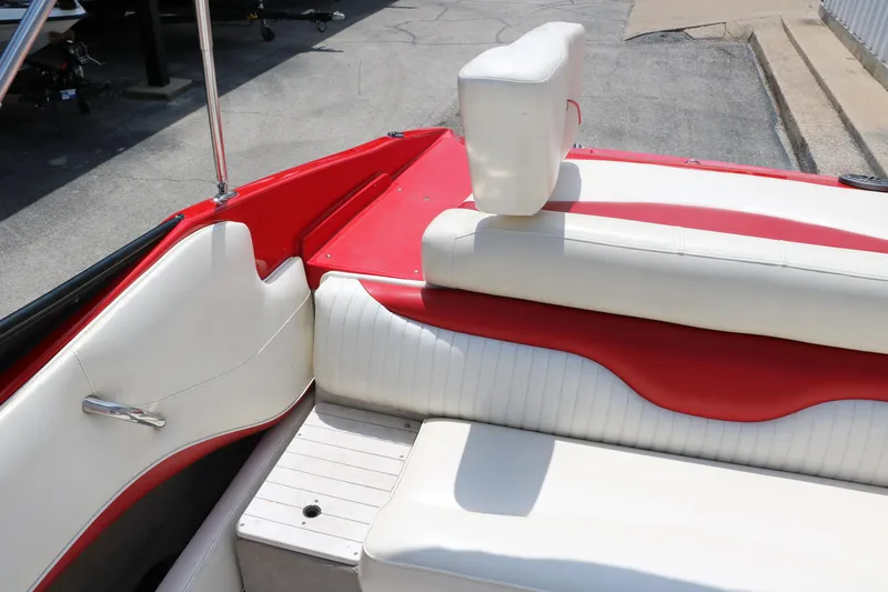 Slide: The Image of 2009 Crownline 23 SS boat interior with red and white seating. - 42